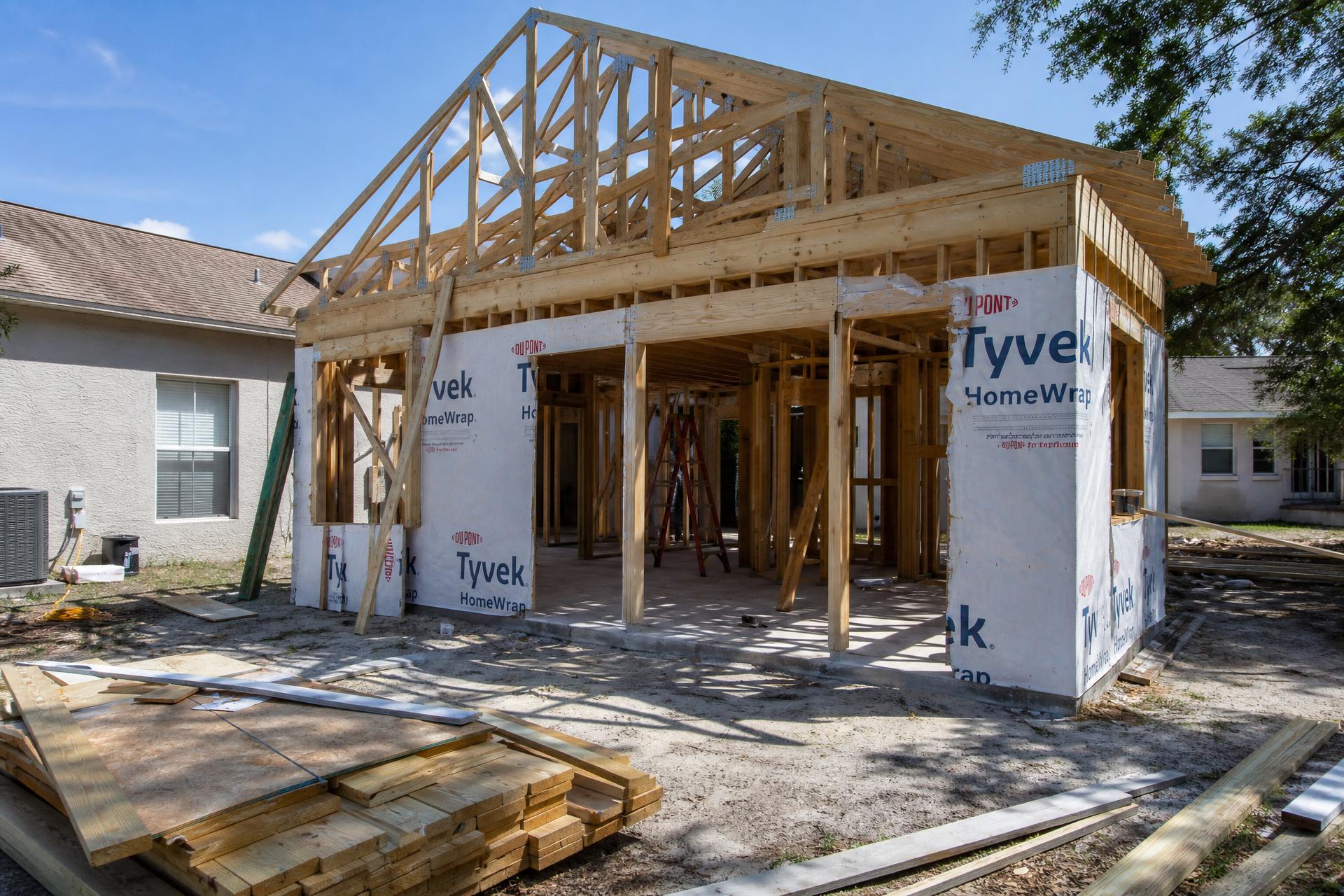 Home addition under construction attached to an existing house